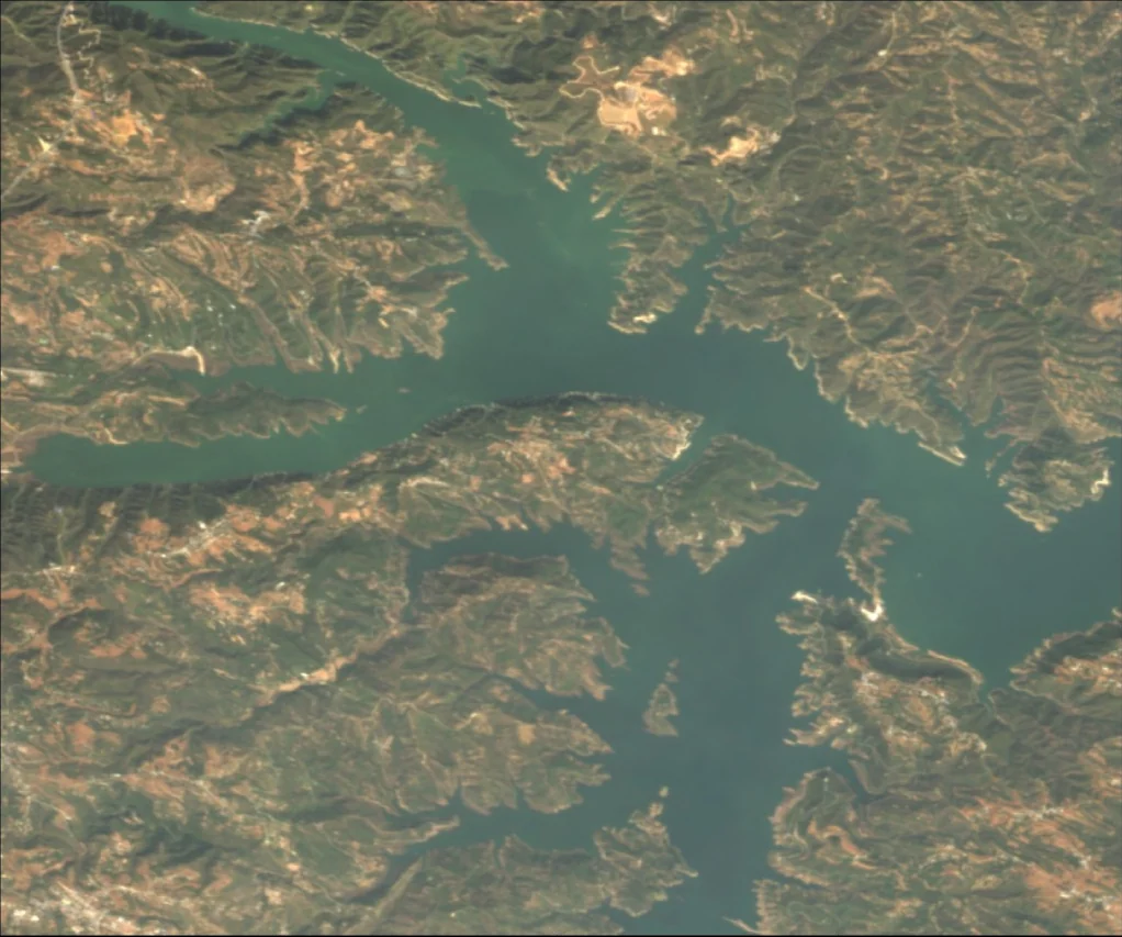 Satellite view of the branching waterways and surrounding hills of Wanshanhu Reservoir